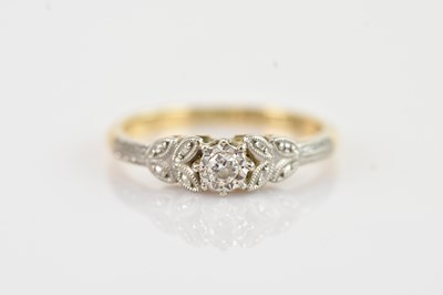 Lot 244 - A 9ct yellow gold and platinum diamond dress...