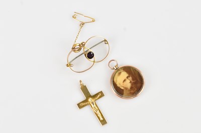 Lot 257 - A yellow metal crucifix stamped 9ct, an...