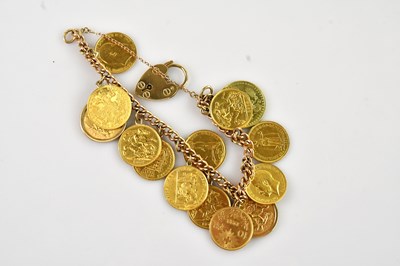 Lot 236 - A 9ct gold curb link bracelet set with nine...