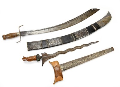 Lot 1060 - An Eastern kris with scabbard, length of blade...