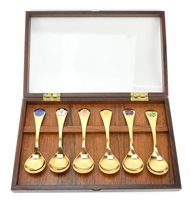 Lot 122 - GEORG JENSEN; six silver gilt and enamel year...