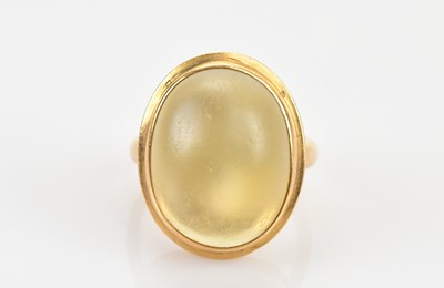 Lot 479 - A Chinese yellow metal moonstone dress ring,...