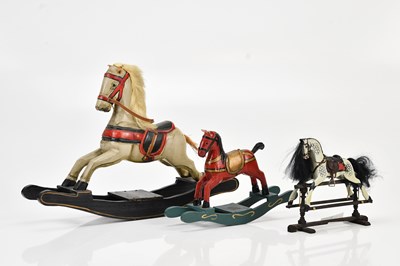 Lot 2075 - A hand carved red painted dolls house rocking...
