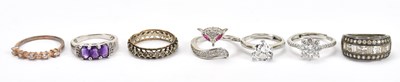 Lot 592 - A 9ct gold and silver eternity dress ring,...