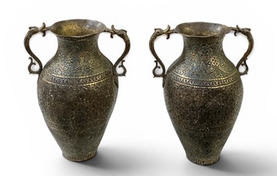 Lot 1041 - A pair of early 20th century Indian brass and...