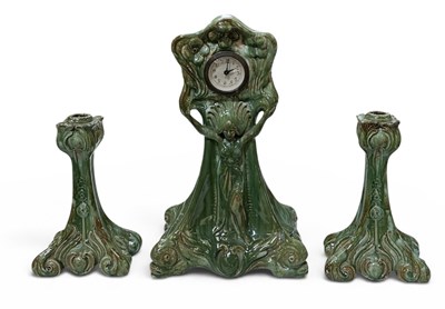 Lot 162 - An early 20th century green glazed majolica...