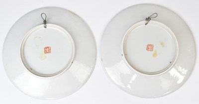 Lot 255 - A pair Chinese famille rose plates, decorated...