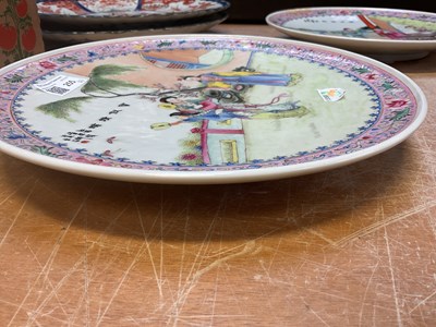 Lot 255 - A pair Chinese famille rose plates, decorated...