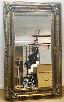 Lot 774 - A very large ornate framed mirror, with...