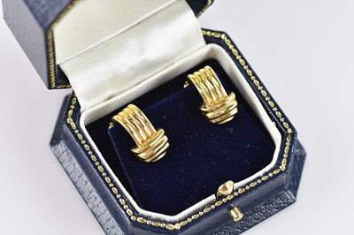 Lot 239 - A pair of 18ct yellow gold clip-on earrings of...