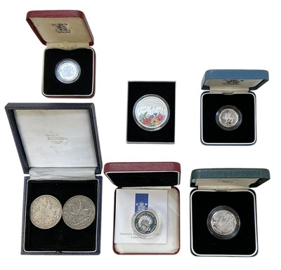 Lot 1589 - A group of cased silver and silver proof coins...