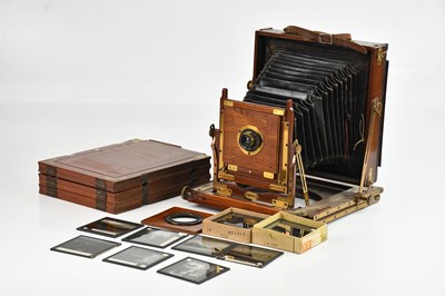 Lot 139 - A mahogany plate camera, with brass hardware,...