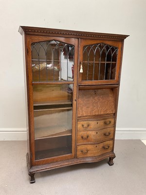 Lot 181 - An unusual 1920s oak bureau display cabinet...