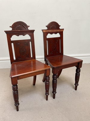 Lot 231 - A pair of Victorian carved walnut hall chairs,...