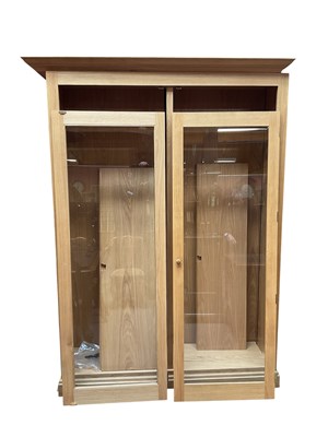 Lot 2128 - A modern bespoke light oak display cabinet,...