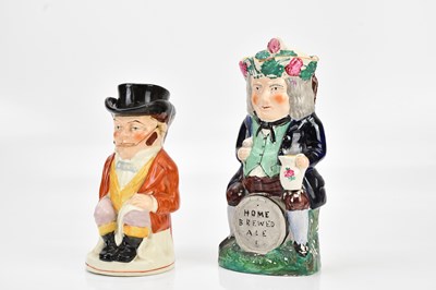 Lot 1380 - STAFFORDSHIRE; a polychrome decorated Toby jug...