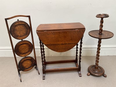 Lot 230 - A 1920s oak folding cake stand, drop-leaf...