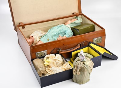 Lot 2073 - A vintage suitcase containing various toys...
