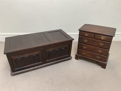 Lot 2104 - A small reproduction oak chest of two short...