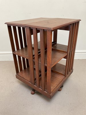 Lot 2040 - A late 19th century oak revolving bookcase, on...