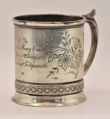 Lot 1138 - G. SEITERT; a sterling silver christening mug,...