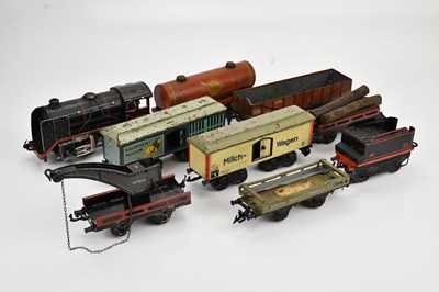 Lot 2209 - A German tinplate clockwork locomotive and...