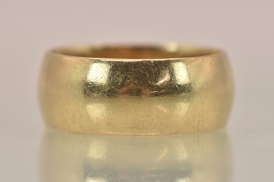 Lot 1276 - A 9ct yellow gold wide band ring, size U,...