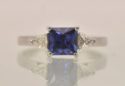 Lot 1233 - A platinum (950) diamond and sapphire set ring,...