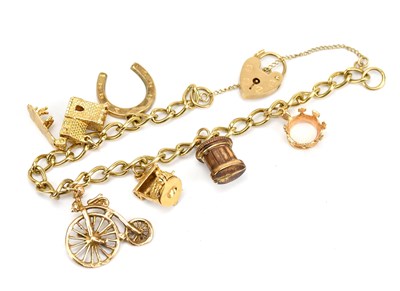 Lot 87 - A 9ct yellow gold charm bracelet, with five...