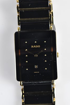 Lot 1143 - RADO; a gentleman's black ceramic and gold...