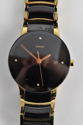 Lot 1144 - RADO; a gentleman's black ceramic and gold...