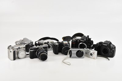 Lot 108 - A collection of digital cameras, comprising an...