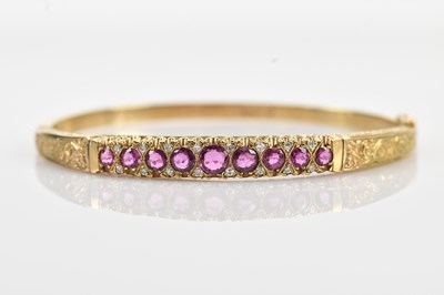 Lot 88 - A 9ct yellow gold hinged snap bangle with...