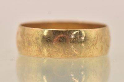 Lot 1341 - A 9ct yellow gold band ring, size R, approx...