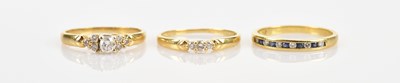 Lot 402 - A trio of 18ct yellow gold diamond set dress...