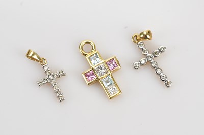 Lot 283 - A diamond aquamarine and amethyst set cross...