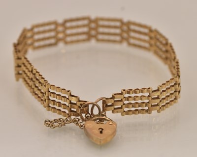 Lot 1507 - A 9ct yellow gold gate link bracelet with...