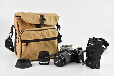 Lot 130 - OLYMPUS; an OM10 camera with Olympus OM-System...