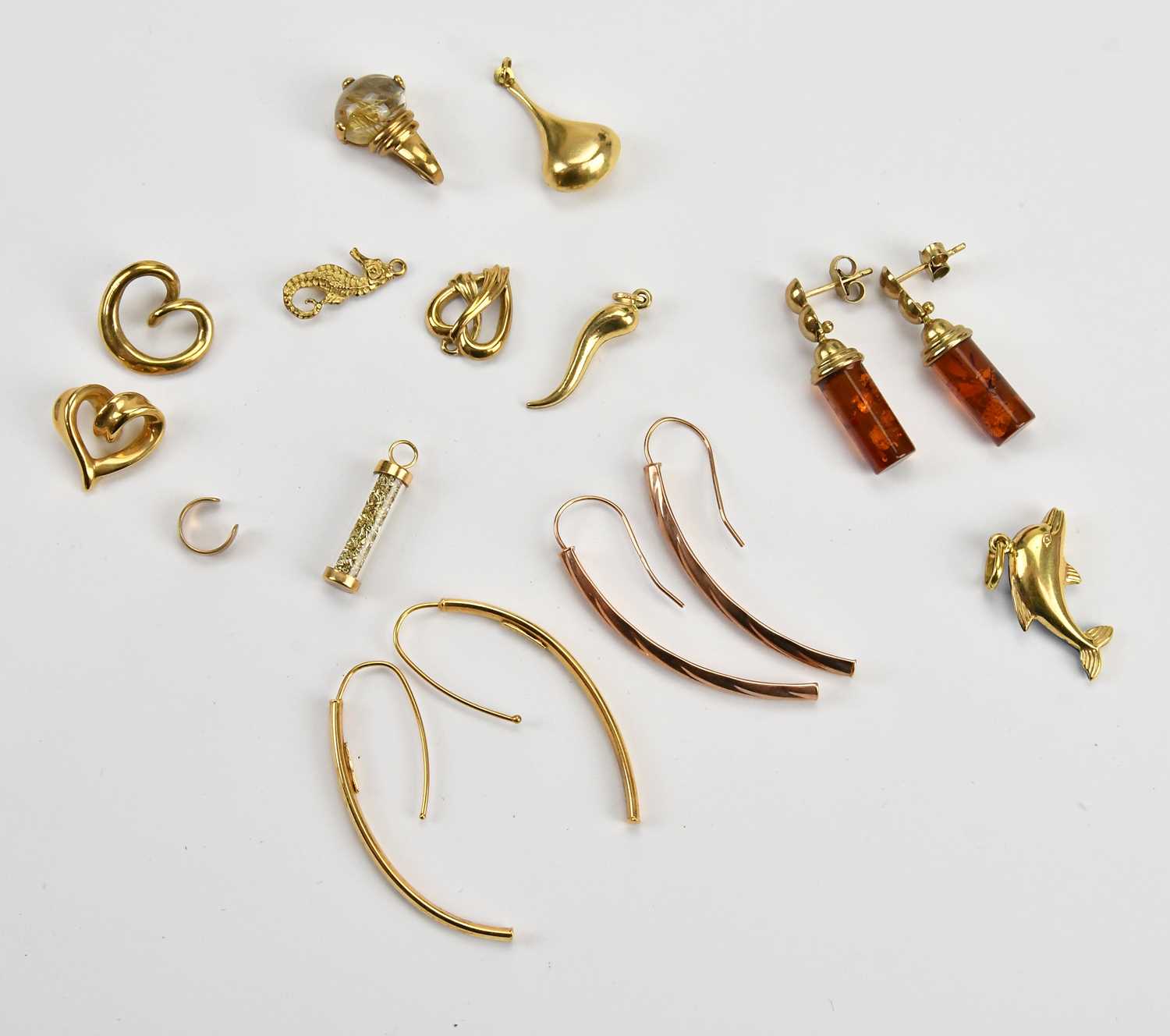 Lot 8 - A yellow metal heart shaped crossover pendant,...