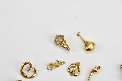 Lot 8 - A yellow metal heart shaped crossover pendant,...