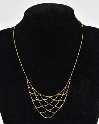 Lot 277 - A 9ct yellow gold beaded collette, length 413mm.