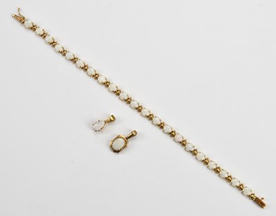 Lot 78 - A yellow metal opal set bracelet, stamped '10K'...