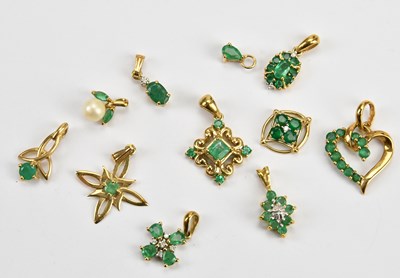 Lot 279 - Eleven 9ct yellow gold and emerald set...