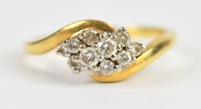Lot 469 - An 18ct yellow gold diamond set crossover...