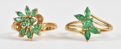 Lot 487 - Two 9ct yellow gold emerald set cluster rings,...