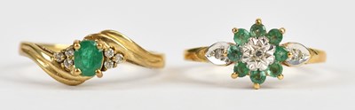 Lot 526 - A 9ct yellow gold diamond and emerald set...