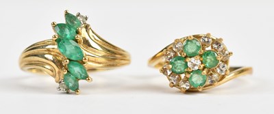 Lot 528 - A 9ct yellow gold diamond and emerald seven...