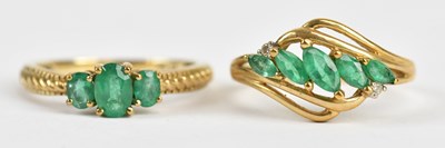 Lot 461 - A 9ct yellow gold three stone dress ring set...