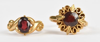 Lot 529 - Two 9ct yellow gold garnet set dress rings,...