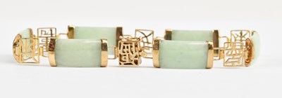 Lot 53 - A Chinese yellow metal mounted and green...